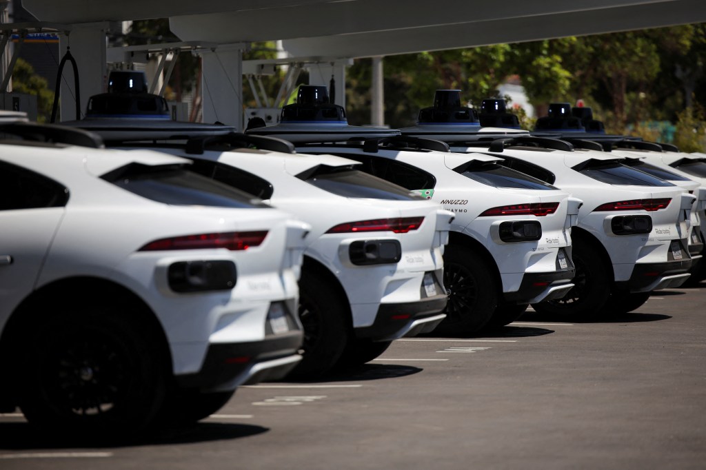 Waymo self-driving cars by loading at a charging station.